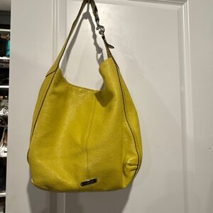 This is a Coach Avery leather hobo shoulder bag in a yellow (chartreuse) color w